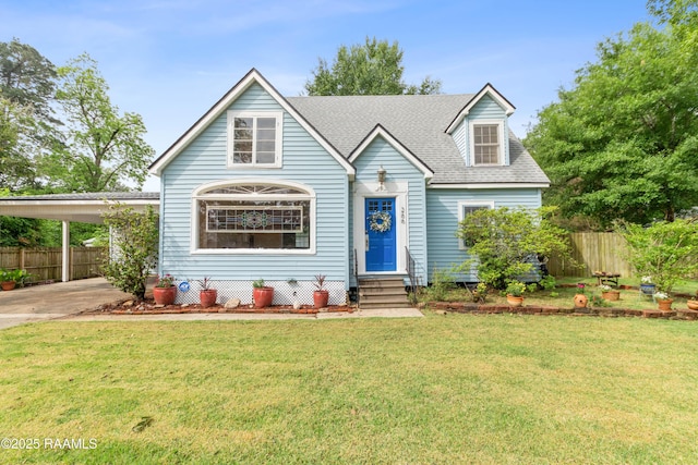 view of front of property featuring fence, entry steps, and a front yard