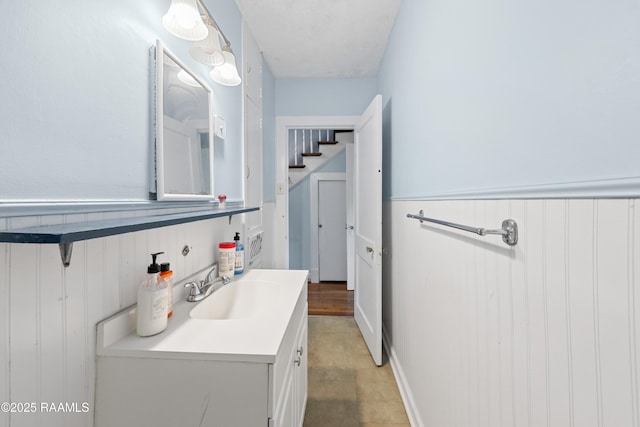bathroom with wainscoting and vanity
