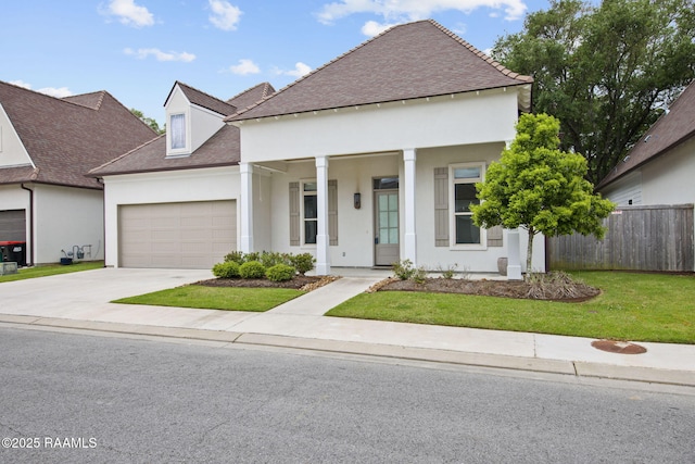 102 Drifting Sands Ln, Lafayette, LA 70503 - view of front facade with stucco siding, fence, driveway, roof with shingles, and an attached garage