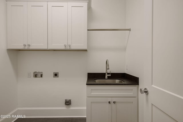 102 Drifting Sands Ln, Lafayette, LA 70503 - laundry area with hookup for a washing machine, cabinet space, hookup for an electric dryer, a sink, and baseboards