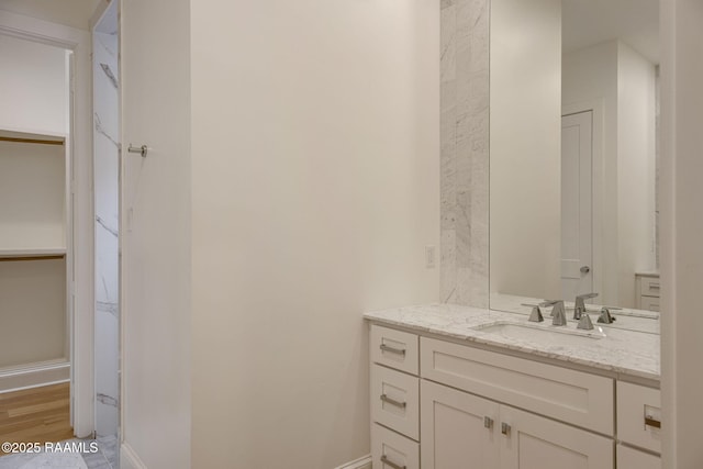102 Drifting Sands Ln, Lafayette, LA 70503 - bathroom with wood finished floors, vanity, and baseboards