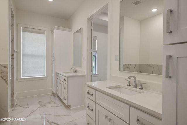 102 Drifting Sands Ln, Lafayette, LA 70503 - bathroom with two vanities, visible vents, marble finish floor, and a sink