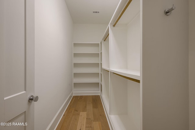 102 Drifting Sands Ln, Lafayette, LA 70503 - spacious closet featuring visible vents and hardwood / wood-style floors
