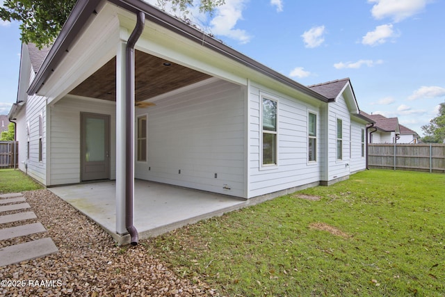102 Drifting Sands Ln, Lafayette, LA 70503 - back of house with a lawn, a patio area, and a fenced backyard