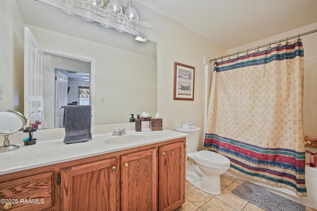 full bath with tile patterned floors, vanity, and toilet