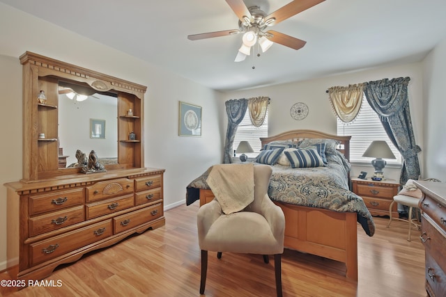 bedroom with ceiling fan and light wood-style flooring