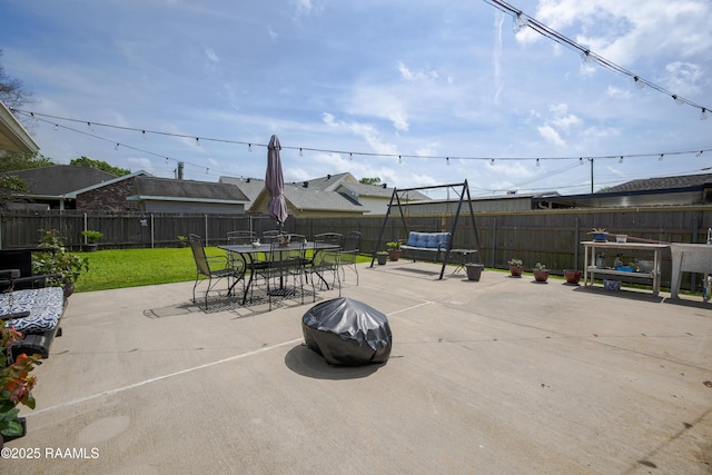 view of patio / terrace featuring outdoor dining space and a fenced backyard