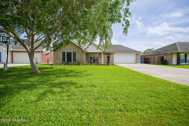 single story home featuring a garage, brick siding, a front lawn, and driveway