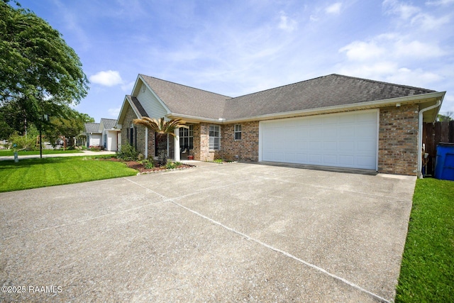 ranch-style house featuring driveway, a shingled roof, an attached garage, and brick siding
