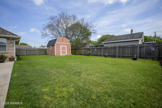 view of yard featuring a fenced backyard, a shed, and an outdoor structure