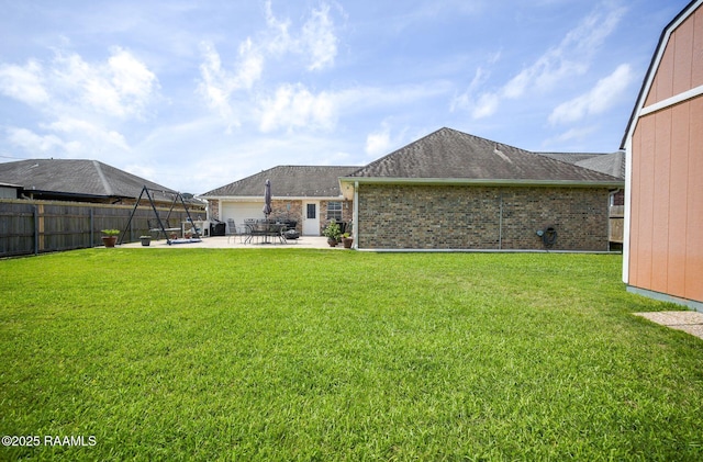 view of yard featuring a patio and a fenced backyard