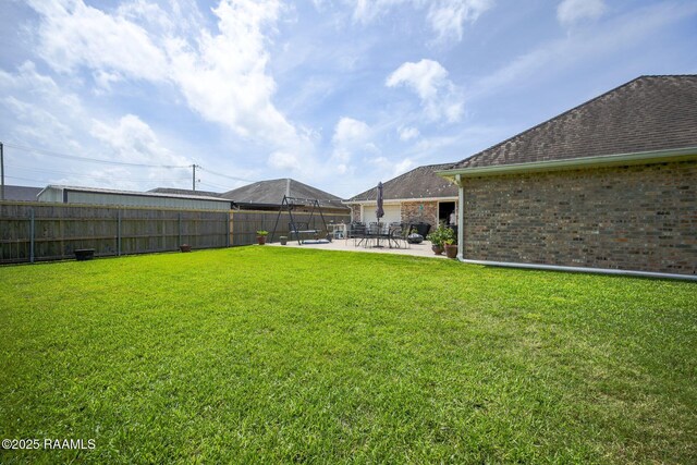 view of yard featuring a patio and a fenced backyard