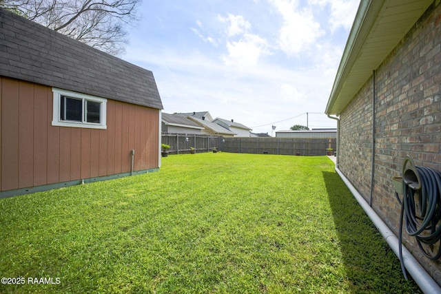 view of yard with a fenced backyard