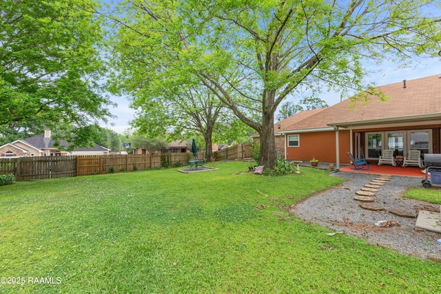 view of yard featuring a patio and a fenced backyard
