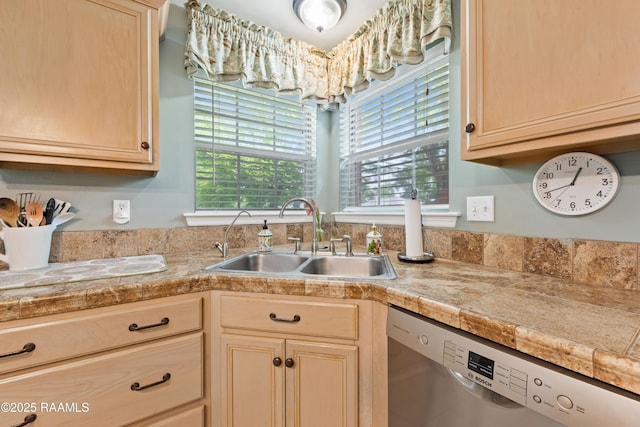 kitchen featuring a sink, light brown cabinetry, dishwasher, and tile countertops