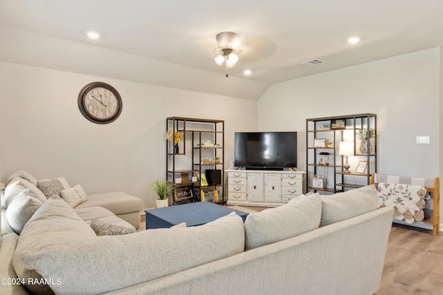 living room featuring visible vents, light wood-type flooring, recessed lighting, vaulted ceiling, and a ceiling fan
