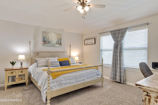 carpeted bedroom with baseboards and ceiling fan