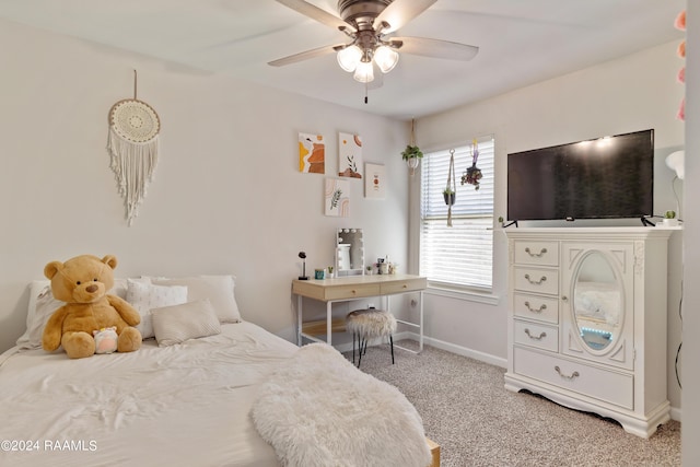 bedroom with baseboards, light carpet, and ceiling fan