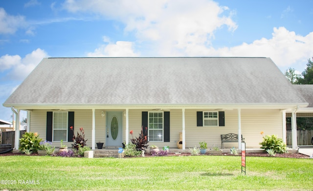 707 W Pine St, Erath, LA 70533 - cape cod home featuring covered porch, a front yard, and a shingled roof
