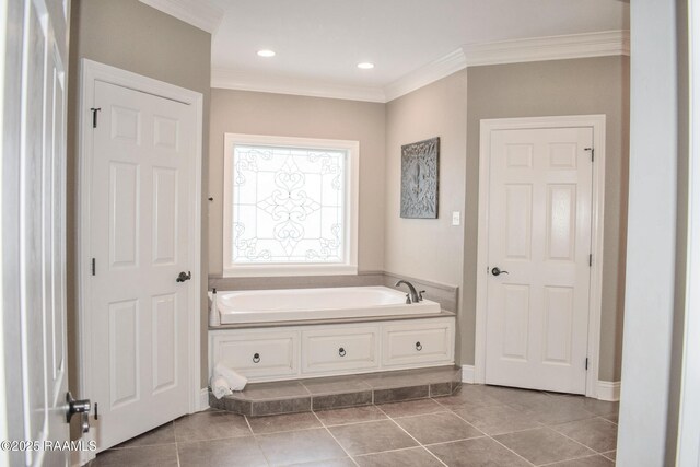 707 W Pine St, Erath, LA 70533 - bathroom featuring a bath, tile patterned flooring, crown molding, baseboards, and recessed lighting