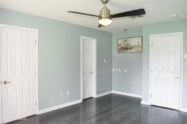 707 W Pine St, Erath, LA 70533 - empty room featuring dark wood-style flooring, ceiling fan, baseboards, and a smoke detector