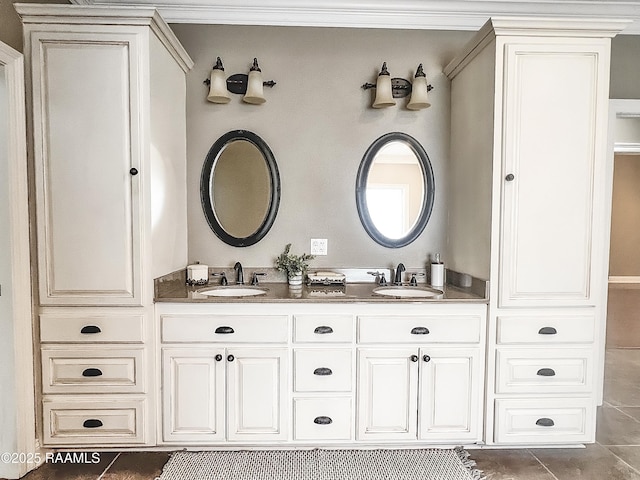 707 W Pine St, Erath, LA 70533 - bathroom featuring double vanity and tile patterned floors