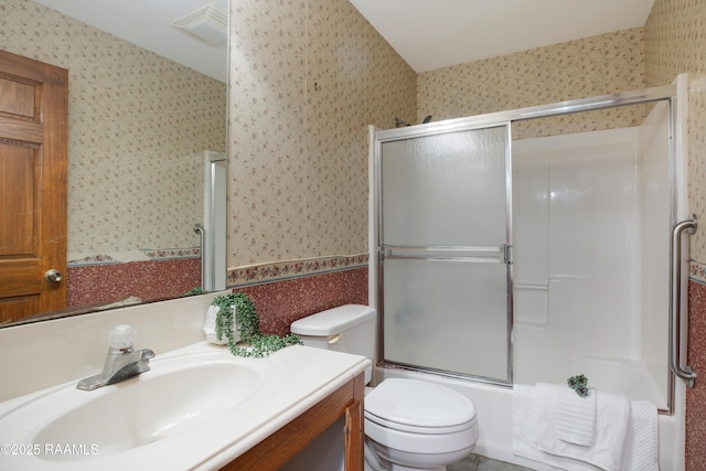111 W Oaklawn Dr, Franklin, LA 70538 - bathroom featuring vanity, enclosed tub / shower combo, toilet, and wallpapered walls