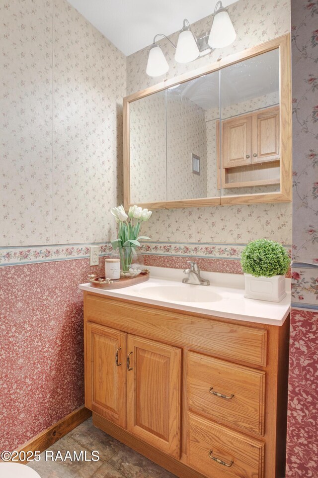 111 W Oaklawn Dr, Franklin, LA 70538 - bathroom featuring vanity and wallpapered walls