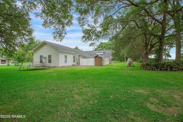 111 W Oaklawn Dr, Franklin, LA 70538 - view of yard with fence and a trampoline
