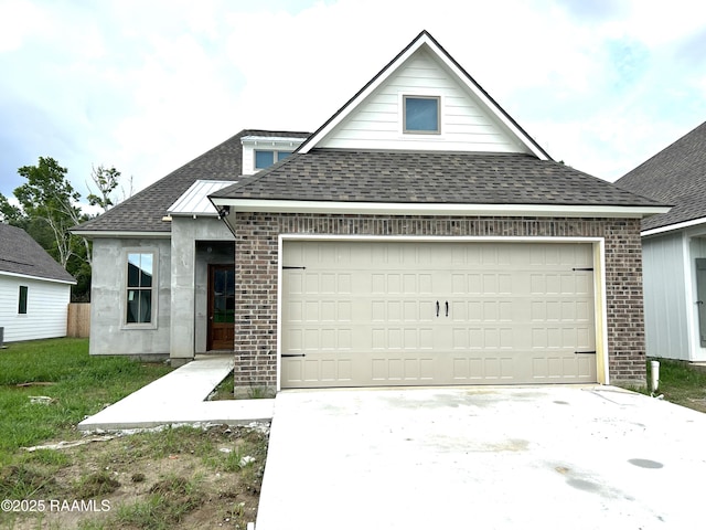 111 Fillmore Way, Lafayette, LA 70506 - view of front facade with a shingled roof, brick siding, an attached garage, and driveway