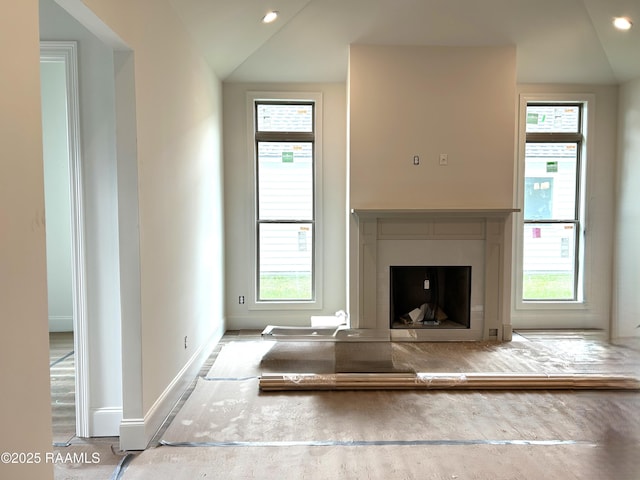 111 Fillmore Way, Lafayette, LA 70506 - unfurnished living room with healthy amount of natural light, a fireplace, lofted ceiling, and recessed lighting
