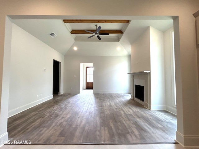 111 Fillmore Way, Lafayette, LA 70506 - unfurnished living room featuring a ceiling fan, beam ceiling, a fireplace, wood finished floors, and a high ceiling