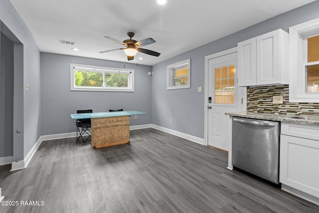 office area with ceiling fan, dark wood finished floors, baseboards, and visible vents