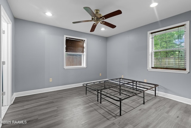 bedroom featuring baseboards, ceiling fan, recessed lighting, and wood finished floors
