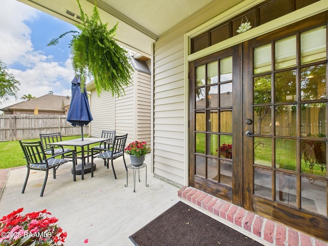 124 Vestige Cir, Lafayette, LA 70508 - view of patio / terrace with outdoor dining space, french doors, and fence