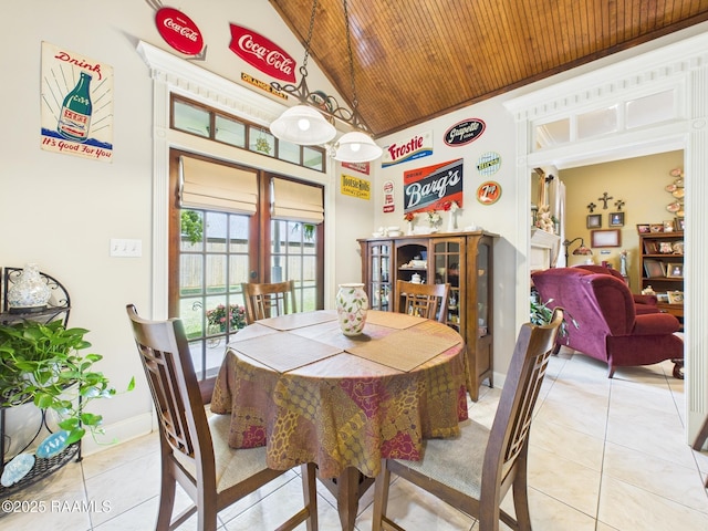 124 Vestige Cir, Lafayette, LA 70508 - dining room with wood ceiling, light tile patterned flooring, high vaulted ceiling, and baseboards