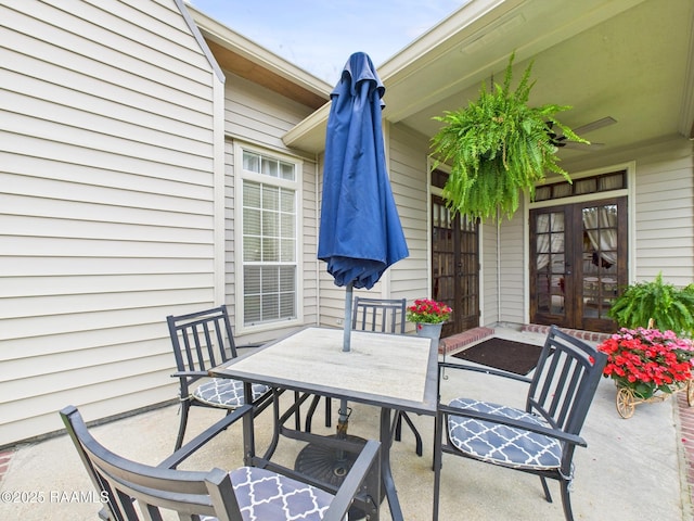 124 Vestige Cir, Lafayette, LA 70508 - view of patio featuring french doors, outdoor dining space, and a ceiling fan