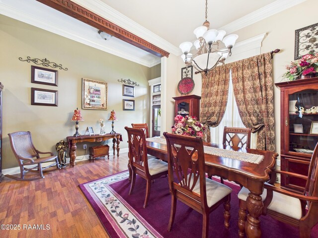 124 Vestige Cir, Lafayette, LA 70508 - dining room featuring crown molding, an inviting chandelier, wood finished floors, and baseboards