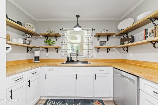 kitchen with open shelves, wooden counters, dishwasher, a sink, and crown molding