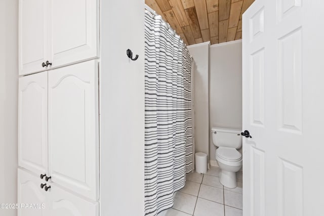 bathroom featuring curtained shower, toilet, tile patterned flooring, and wood ceiling