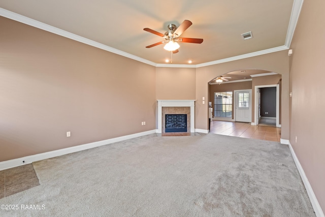 4000 Mchugh Rd Unit 102, Zachary, LA 70791 - unfurnished living room featuring ceiling fan, carpet flooring, arched walkways, crown molding, and baseboards