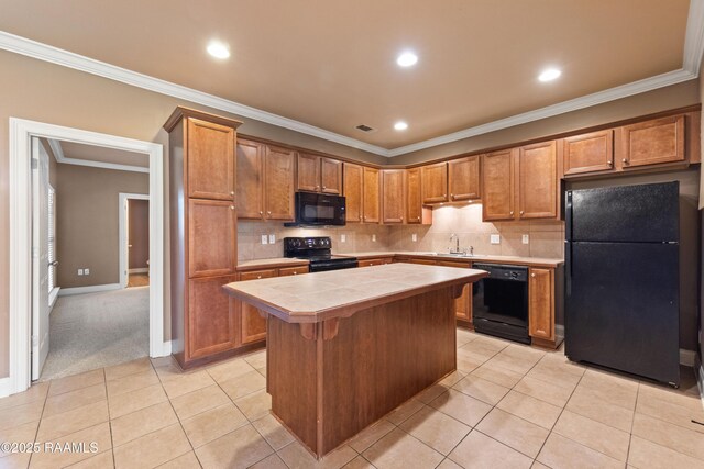 4000 Mchugh Rd Unit 102, Zachary, LA 70791 - kitchen with black appliances, tile countertops, a sink, a kitchen island, and light tile patterned floors