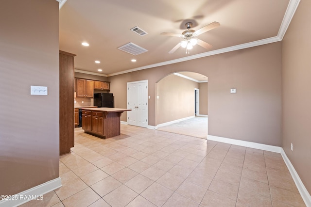 4000 Mchugh Rd Unit 102, Zachary, LA 70791 - kitchen featuring freestanding refrigerator, arched walkways, crown molding, light countertops, and ceiling fan