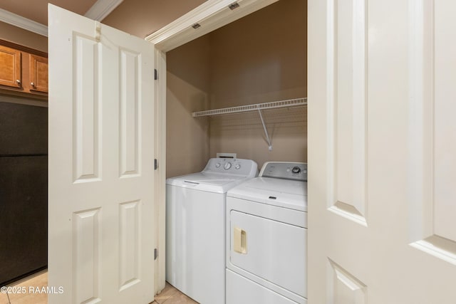 4000 Mchugh Rd Unit 102, Zachary, LA 70791 - clothes washing area featuring washer and clothes dryer and light tile patterned flooring