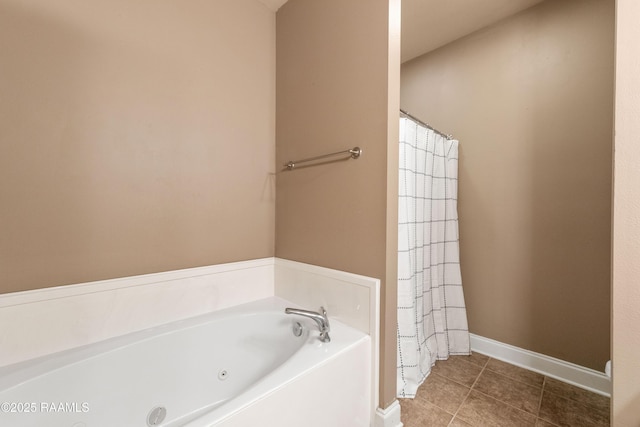 4000 Mchugh Rd Unit 102, Zachary, LA 70791 - full bath featuring a garden tub, tile patterned floors, baseboards, and a shower with shower curtain