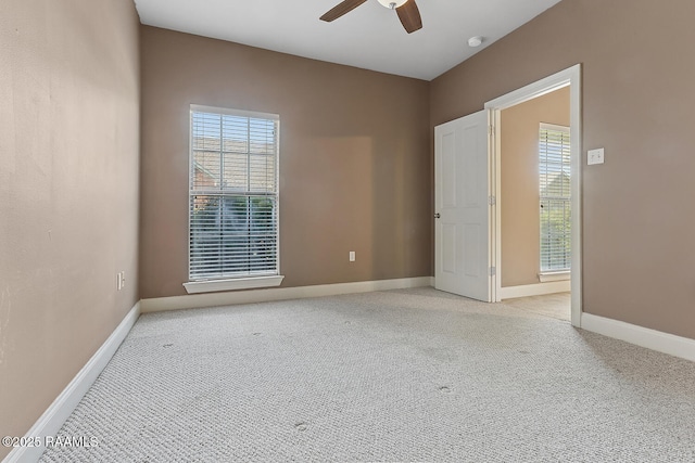 4000 Mchugh Rd Unit 102, Zachary, LA 70791 - spare room featuring a ceiling fan, light carpet, and healthy amount of natural light