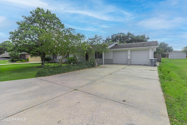 110 Karen Dr, Lafayette, LA 70503 - ranch-style home featuring a front yard, driveway, and a garage