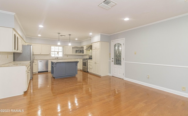 110 Karen Dr, Lafayette, LA 70503 - kitchen with appliances with stainless steel finishes, visible vents, and crown molding