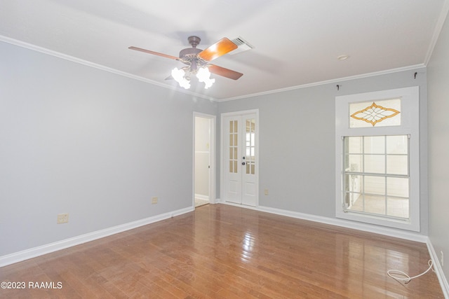 110 Karen Dr, Lafayette, LA 70503 - unfurnished room featuring crown molding, ceiling fan, visible vents, baseboards, and wood finished floors