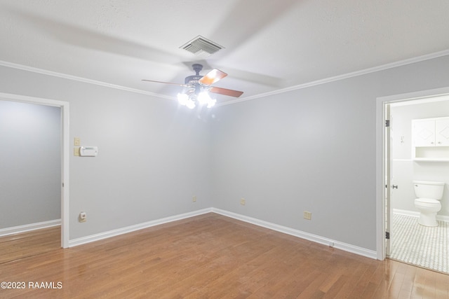 110 Karen Dr, Lafayette, LA 70503 - spare room featuring crown molding, ceiling fan, and light wood-style flooring